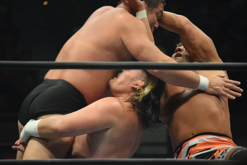 Tenzan and Kojima hit their double cutter on Manabu Nakanishi