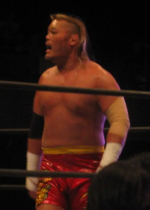 Hiroyoshi Tenzan in red trunks, shouting in the ring